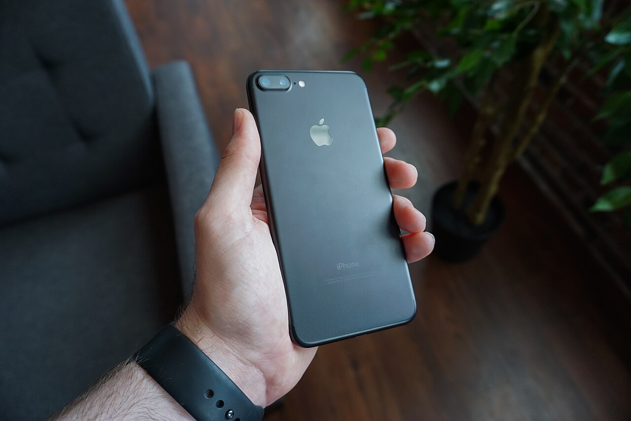 Live odds updating in a betting app on a phone held in one hand