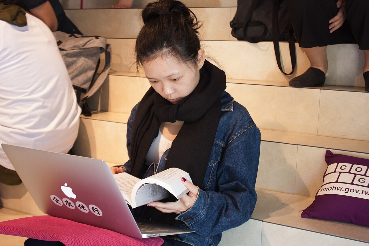 Person reading a help page on a laptop