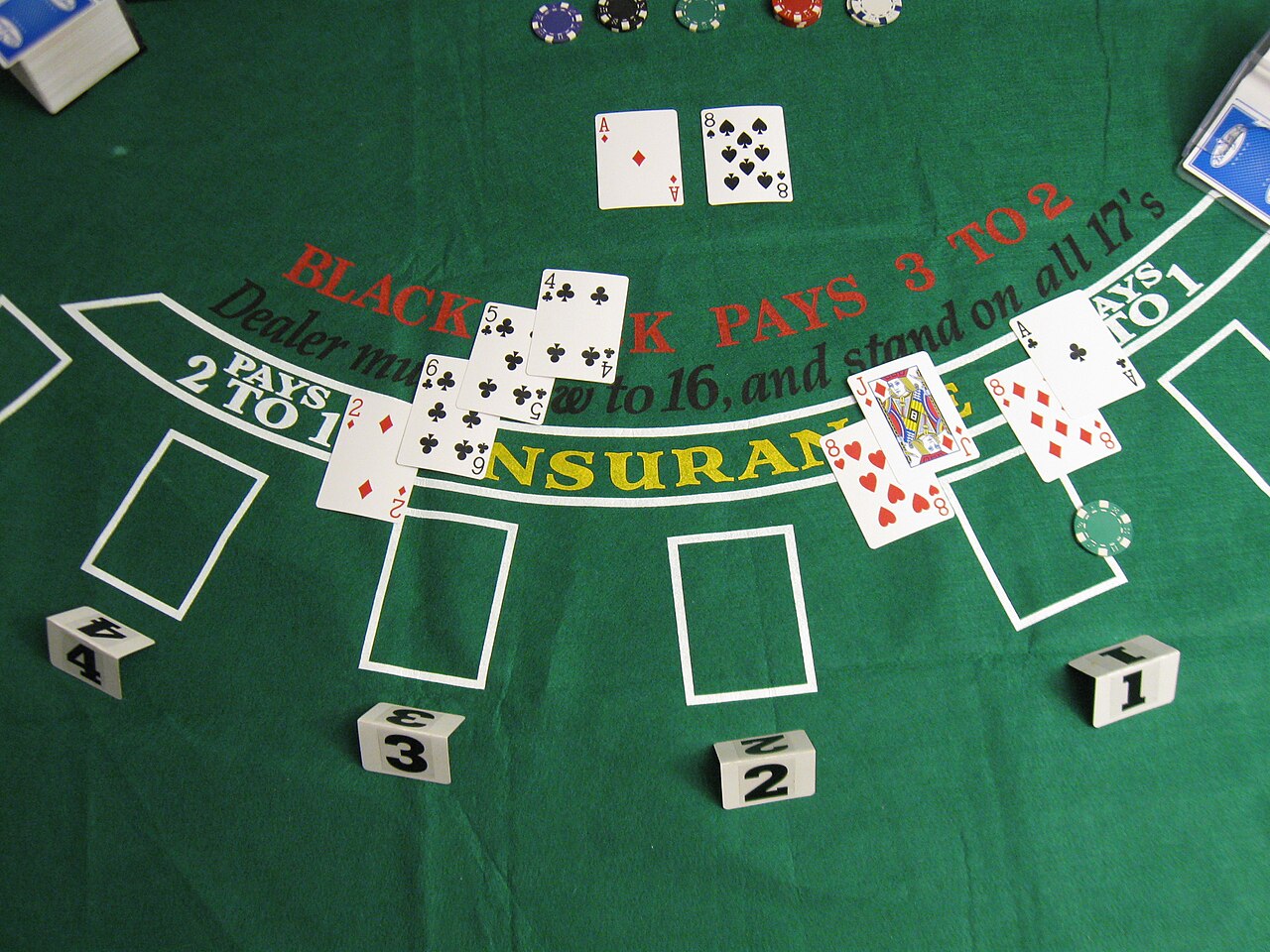 Dealer dealing cards from a shoe under studio lighting