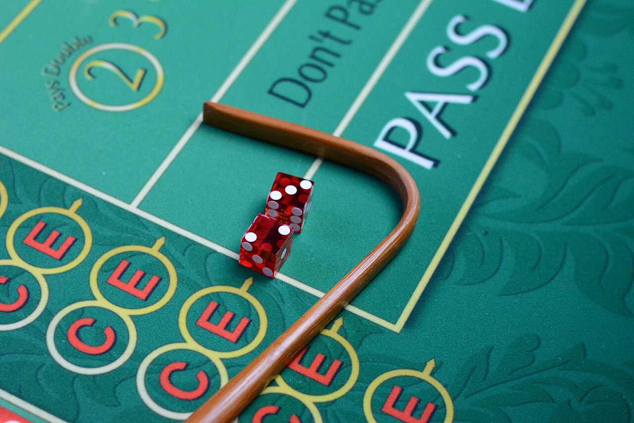 Live casino studio with cameras trained on a dealer at a baccarat table
