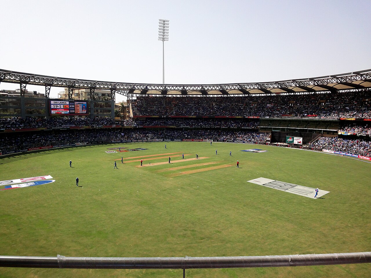 Floodlit cricket stadium in Mumbai during an evening T20 match